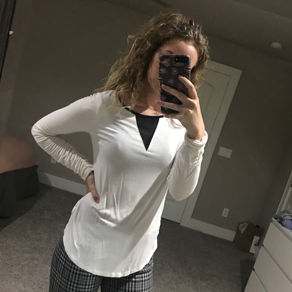White long sleeve blouse with black details